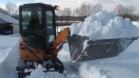 instructions on how to operate a mini excavator|mini excavator plowing snow.